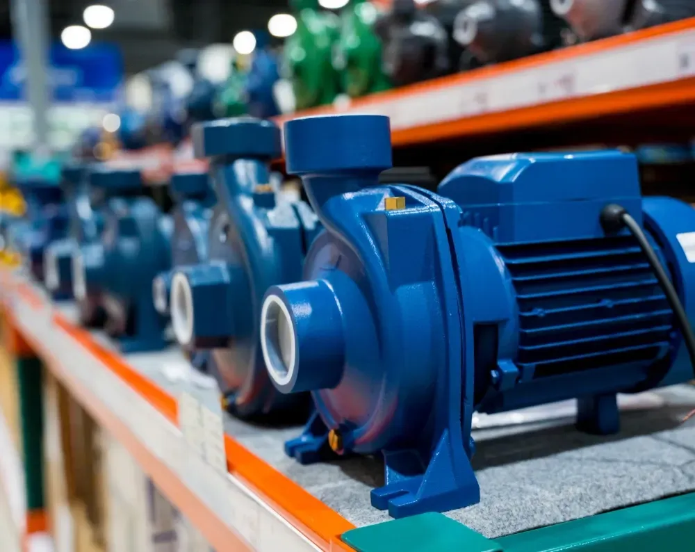 Blue water pumps on a store shelf, showcasing multiple units.