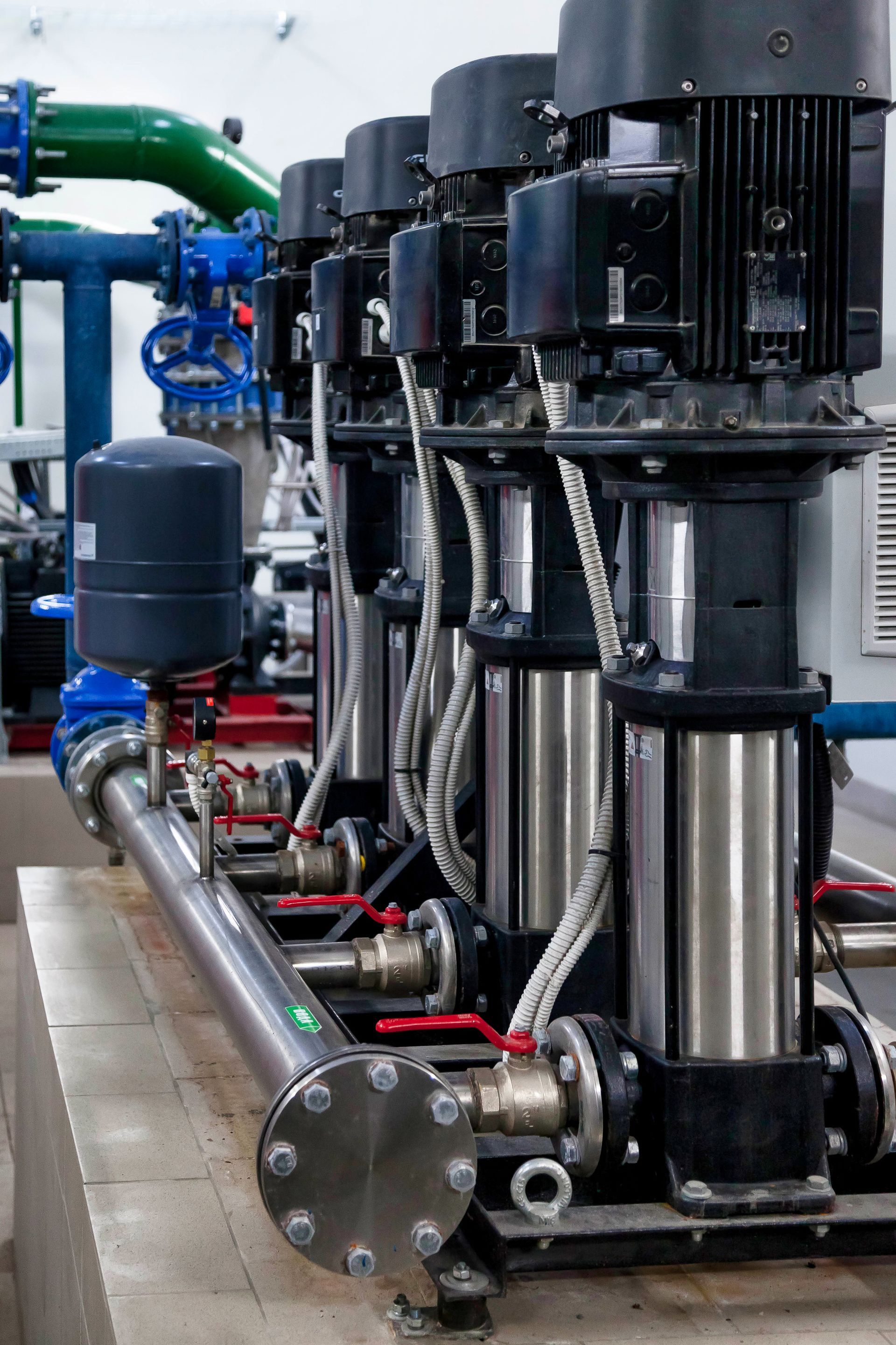 A row of water pumps are lined up in a factory in Fort Myers, FL.