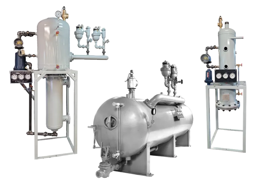 Three industrial metal tanks and attached machinery.