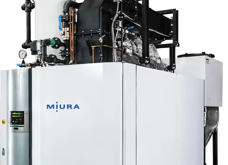 A Miura industrial steam boiler unit with a white metal enclosure and visible mechanical pipes and gauges on top.